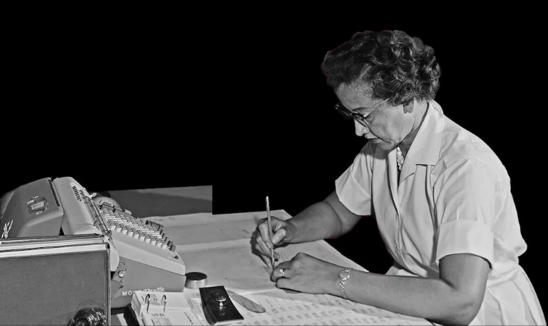 Katherine Johnson calculating trajectories by hand at her desk at NASA